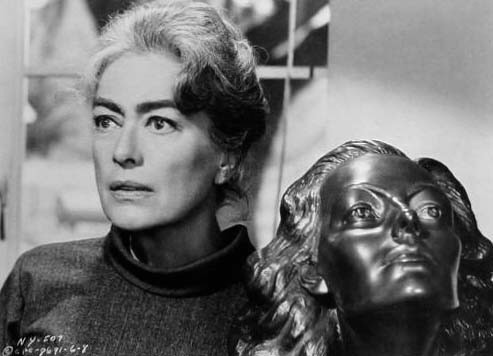 With the same sculpture in 1964's 'Strait-Jacket.'