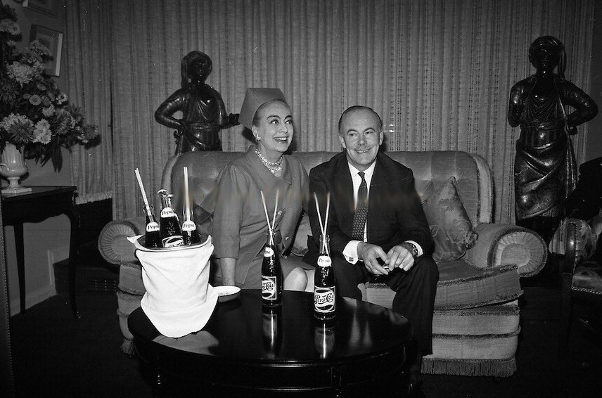 December 14, 1966, at Dublin's Gresham Hotel. Press photo caption: Joan Crawford Press Conference at the Gresham Hotel. Joan Crawford, a director of Pepsi Cola, is in Dublin with Mr. Len Leech, the company's Vice-President for the Northern European Division, for meetings with Pepsi's bottlers in Ireland to discuss new plans for expansion in 1967.