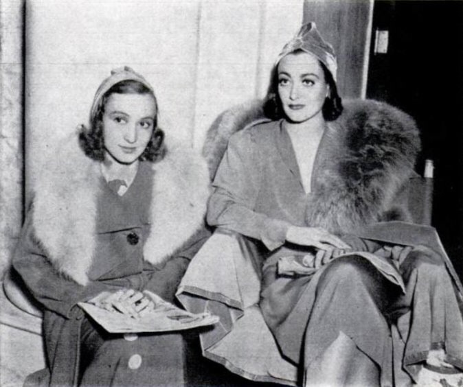1937. On the 'Bride Wore Red' set with sister-in-law Kasha Haroldi. (Thanks to Mateja.)