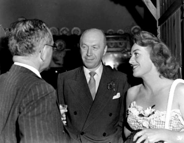 1947. On the set of 'Daisy Kenyon,' with director Preminger.