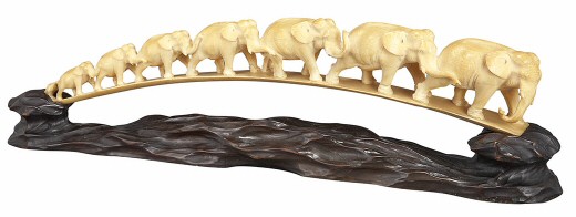 Ivory elephant herd. 18-1/2 in. long. Auctioned at Doyle New York on 12/7/11.