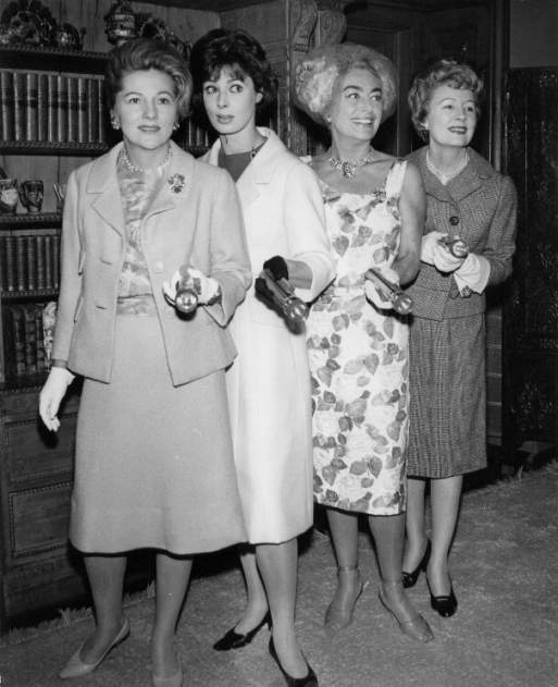 1960. Receiving an unknown award. With Joan Fontaine, Rita Gam, and Irene Dunne.