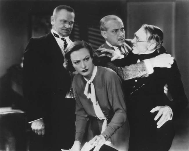 With Wallace Beery, left, and unknown.