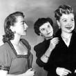 1950. Joan, costumer Sheila O'Brien, and Joan's 'protegee' Marion Morgan, on the set of 'Damned Don't Cry.'