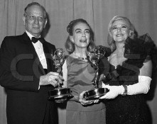 Joan at the '65 Emmys with Melvyn Douglas and Ginger Rogers. Source: CORBIS.