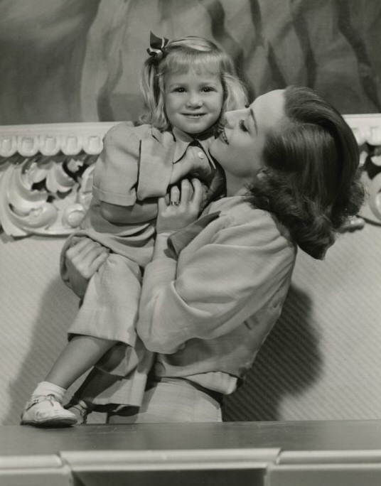 1937 with niece Joanie LeSueur. Shot by Hurrell. (Thanks to HB.)