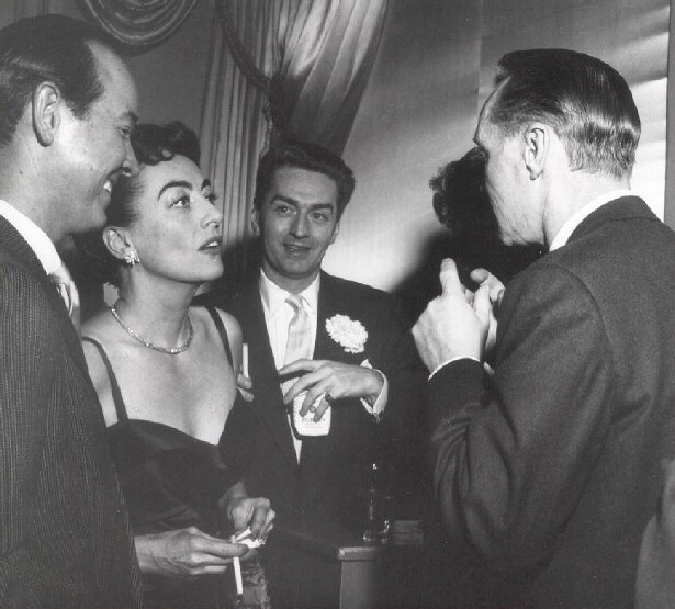 1953. At NYC's Harwin Club with Earl Blackwell, Mike O'Shea, and Franchot Tone.