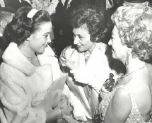 Shirley Eder, center, chats with a twin and Joan