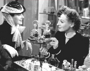 One of Joan's actual shopgirl roles of the '30s: Crystal Allen in 'The Women.' Here, with Rosalind Russell.