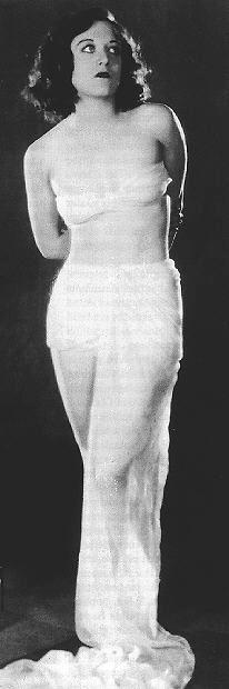 1928, by Ruth Harriet Louise. Joan as Venus de Milo.