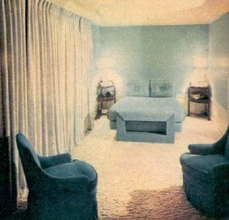 Separated from the rest of the bedroom suite is Joan's sleeping porch. The Dorothy Liebes draperies, heavily lined with black, conceal a wall entirely composed of windows. 