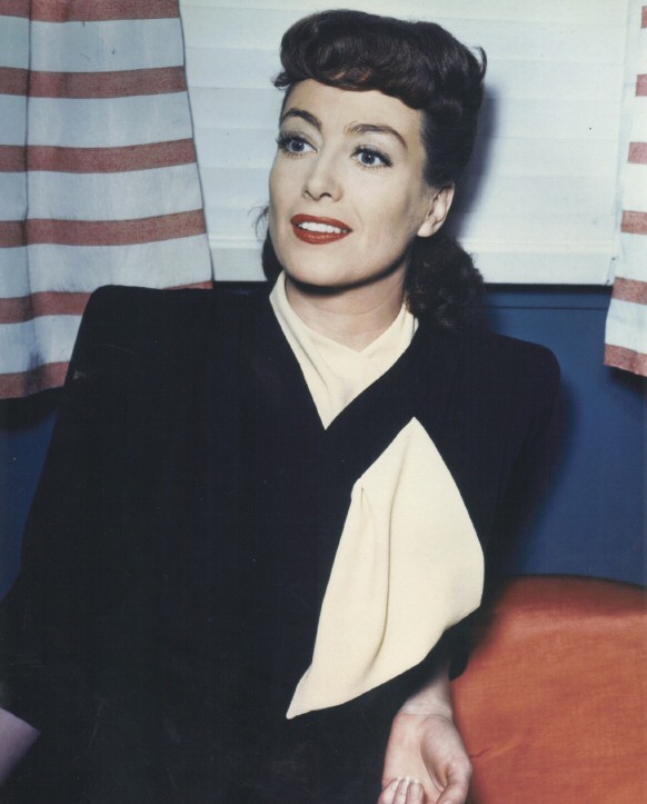 1945. On the set of 'Mildred Pierce.' (Thanks to Norman, who actually OWNS the outfit she's wearing!)