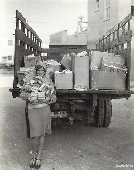 1928. With fan mail on the MGM lot.