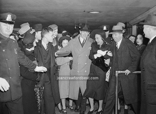 4/9/38. Joan with fans in NYC.