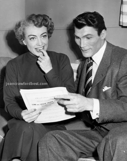 1952. On the set of 'Sudden Fear' with co-star Jack Palance.