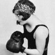 1927. Working out with trainer (later actor) Gene Alsace.