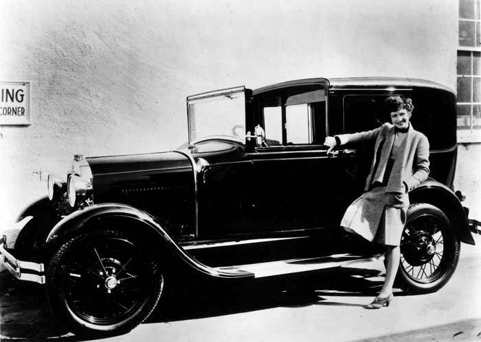 1929. Taking a break from 'Our Modern Maidens' to show off her new Model A Ford.