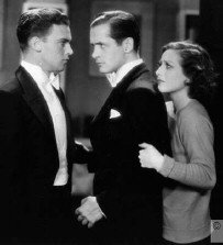 From left: Unknown co-star (Raymond Hackett?), Montgomery, Joan.