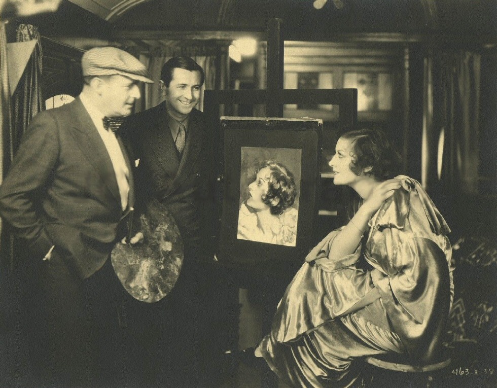 1930. On the set of 'Montana Moon' with artist Henry Clive.