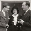 July 1930. With French actor Andre Luguet (left) and Baron Philippe de Rothschild. (Includes press caption.)