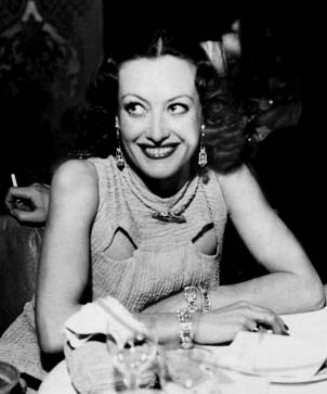 1933. Wearing the Yard bracelet at LA's Cocoanut Grove.