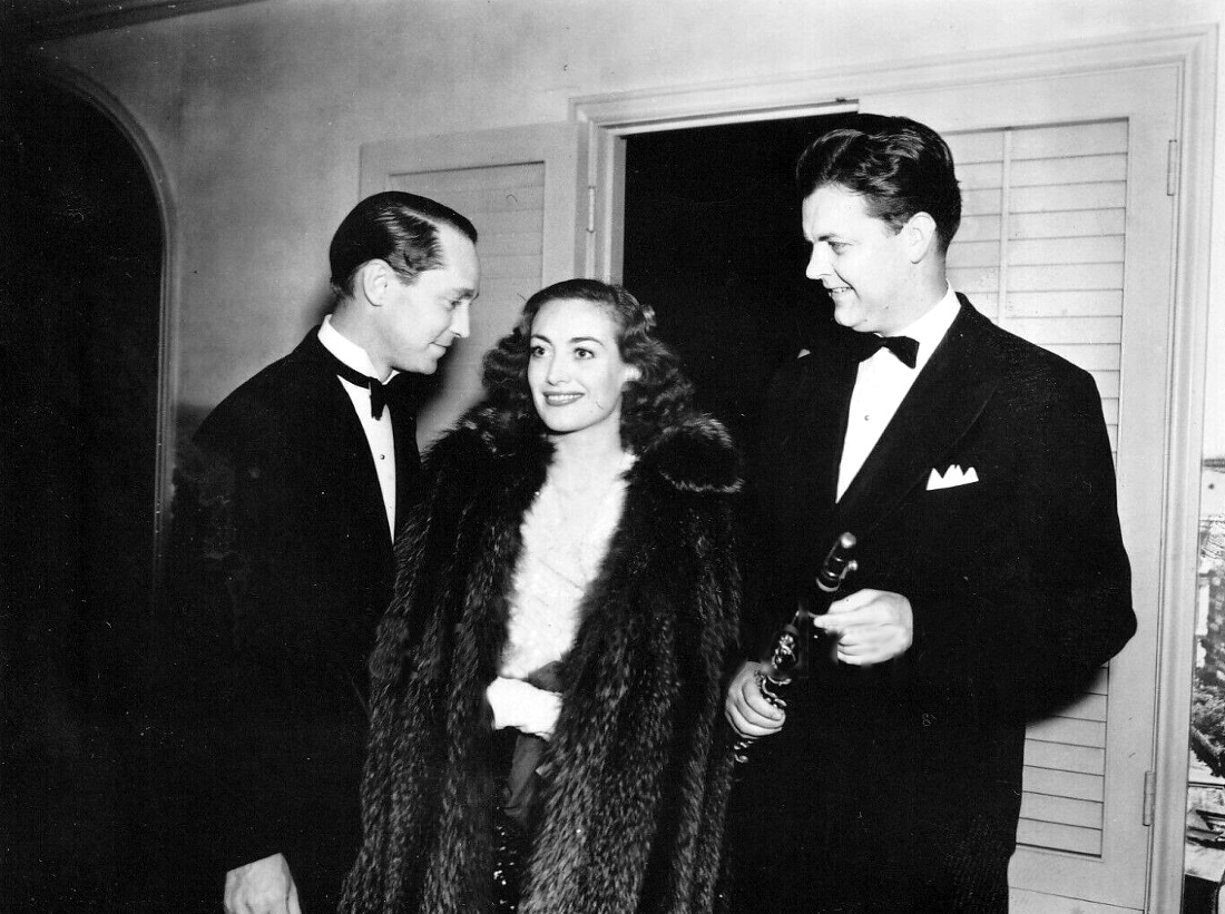 Circa 1938. At an MCA-sponsored party for Bob Tank (right), with husband Franchot Tone.