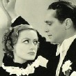 With Franchot Tone.