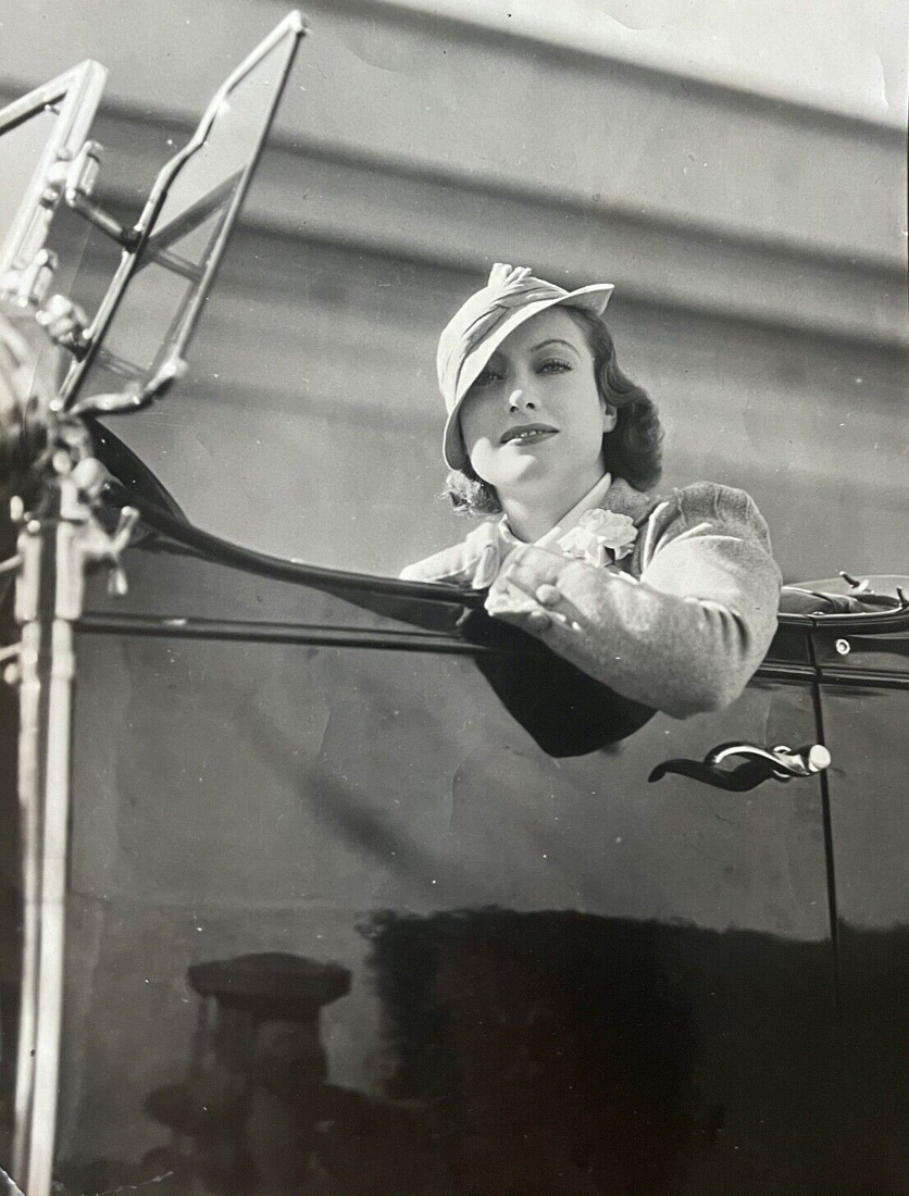 1932. In her Cadillac Fleetwood.