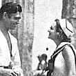 Clark Gable (in 'Mutiny on the Bounty' garb) visiting the 'I Live My Life' set on Catalina Island. (Includes press caption.)