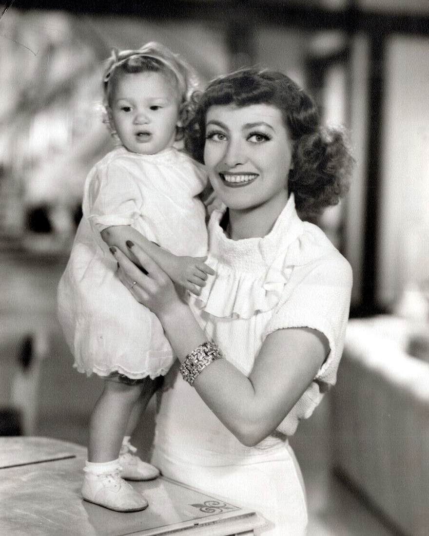 1935. On the set of 'No More Ladies' with niece Joanie.