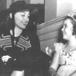 1938. With Shirley Temple on the set of 'Little Miss Broadway.'