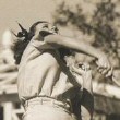 1937. Badminton at home with husband Franchot Tone. (Shot by Bud Graybill.)