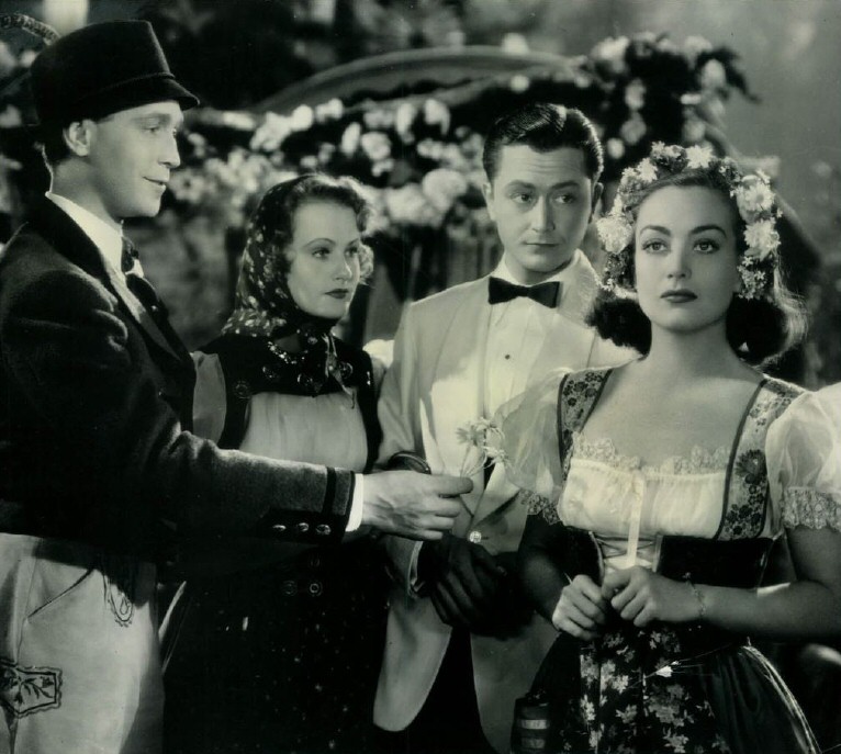 1937. 'The Bride Wore Red.' With Franchot Tone, left, and Robert Young.