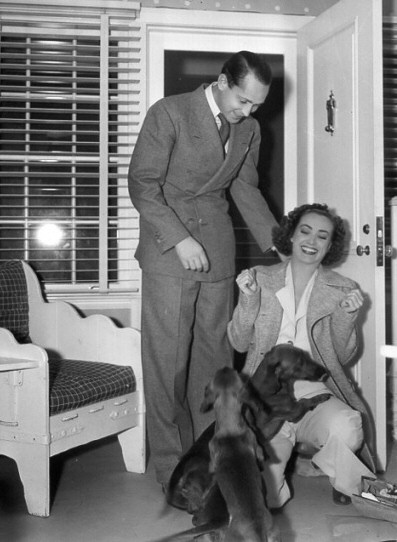 1937. In her dressing room with Franchot Tone on the set of 'The Last of Mrs. Cheyney.'