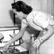 Two photos in her dressing room on the set of 'Mrs. Cheyney.'