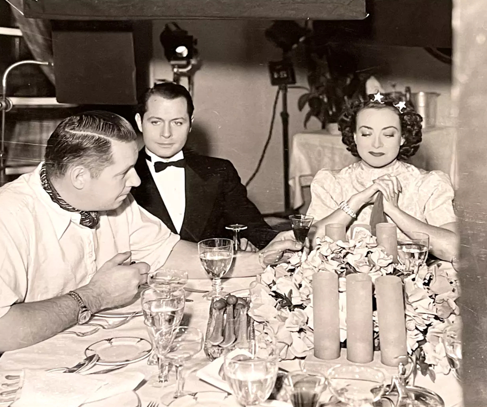 1937. On the set of 'The Last of Mrs. Cheyney' with director Boleslawski and Montgomery.