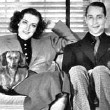 1936. At home with husband Franchot Tone and dachshunds Baby and Bubchen.