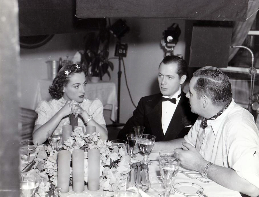 1937. On the set of 'The Last of Mrs. Cheyney' with Robert Montgomery and director Boleslawski. 