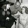 1938. On the set of 'Little Miss Broadway' with director Irving Cummings and Shirley Temple.