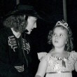 1938. On the set of 'Little Miss Broadway' with Shirley Temple.