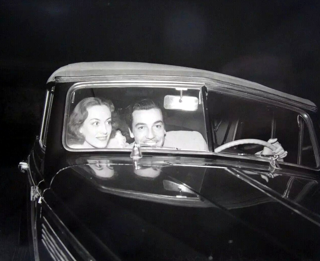 Circa 1938 in Cadillac with Cesar Romero.