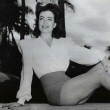 1942. Candid in Miami. Includes press caption.