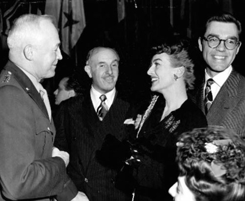 Circa 1943. A party for the military, with Jack Warner and husband Phillip Terry.