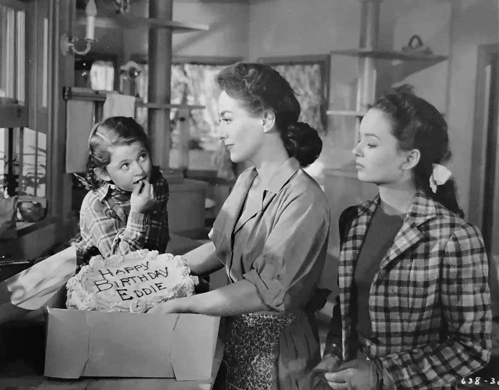 1945. 'Mildred Pierce.' With Jo Ann Marlowe (left) and Ann Blyth.