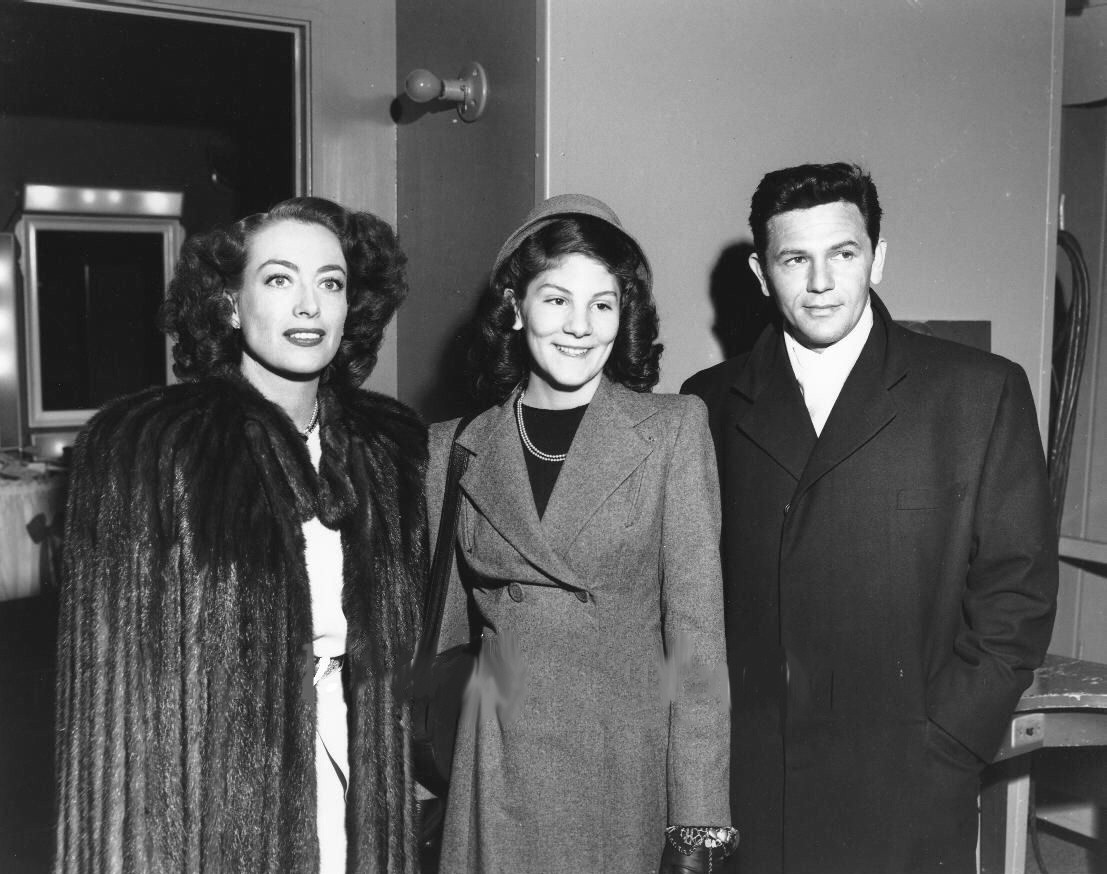 1946. On the set of 'Humoresque' with John Garfield and unknown.