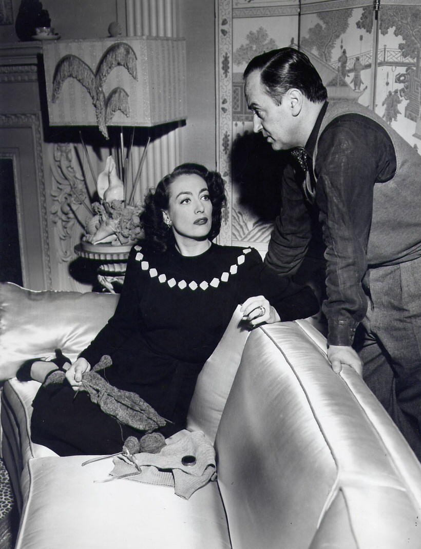 1946. On the set of 'Humoresque' with director Jean Negulesco.