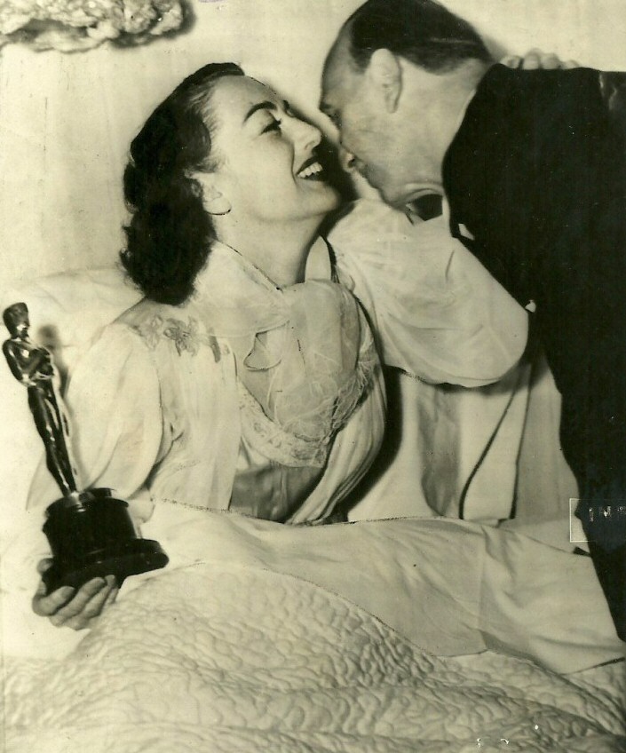 3/7/46. At home with her Oscar and director Mike Curtiz.