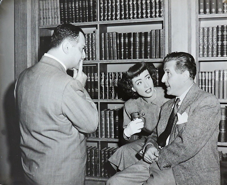 1947. On the set of 'Possessed' with producer Jerry Wald, left, and director Curtis Bernhardt.