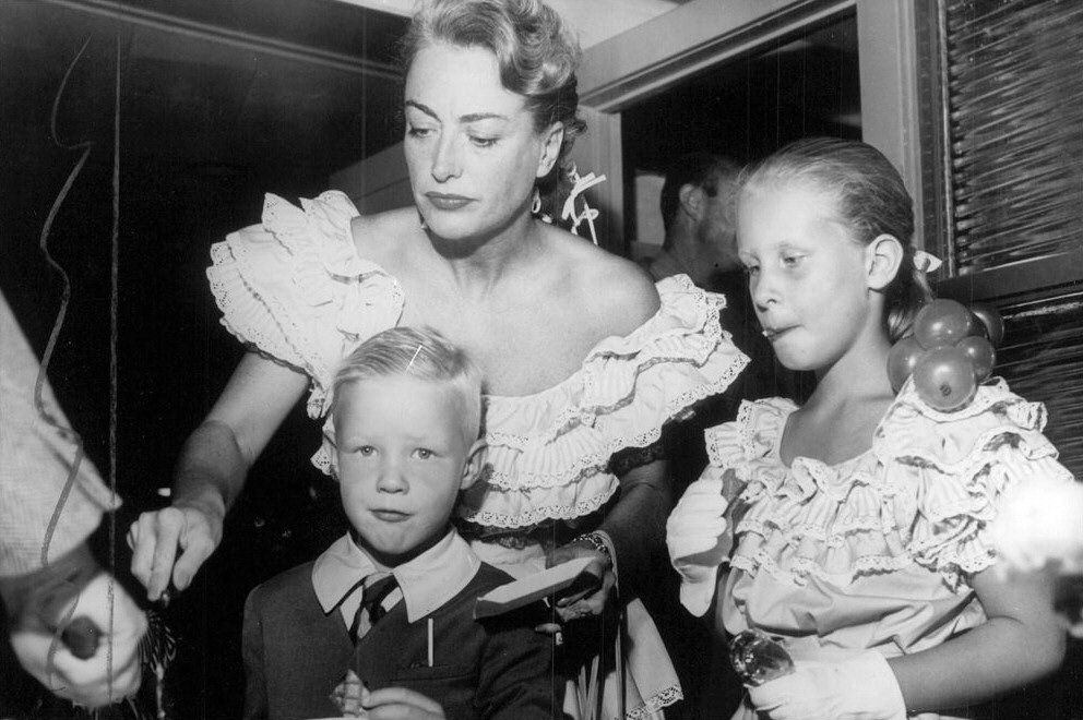 December 1947. At a Beverly Hills toy-store opening with Christopher and Christina.