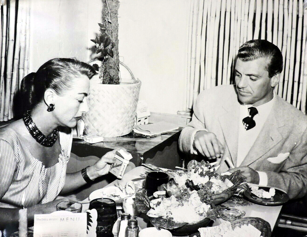 1949. With Greg Bautzer at The Doll House in Palm Springs.